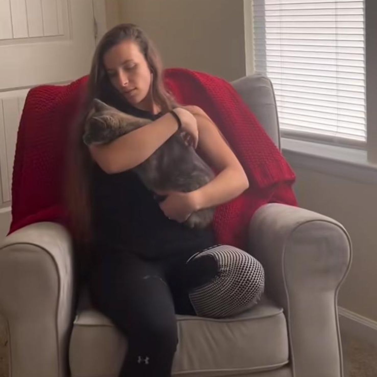 woman petting cat