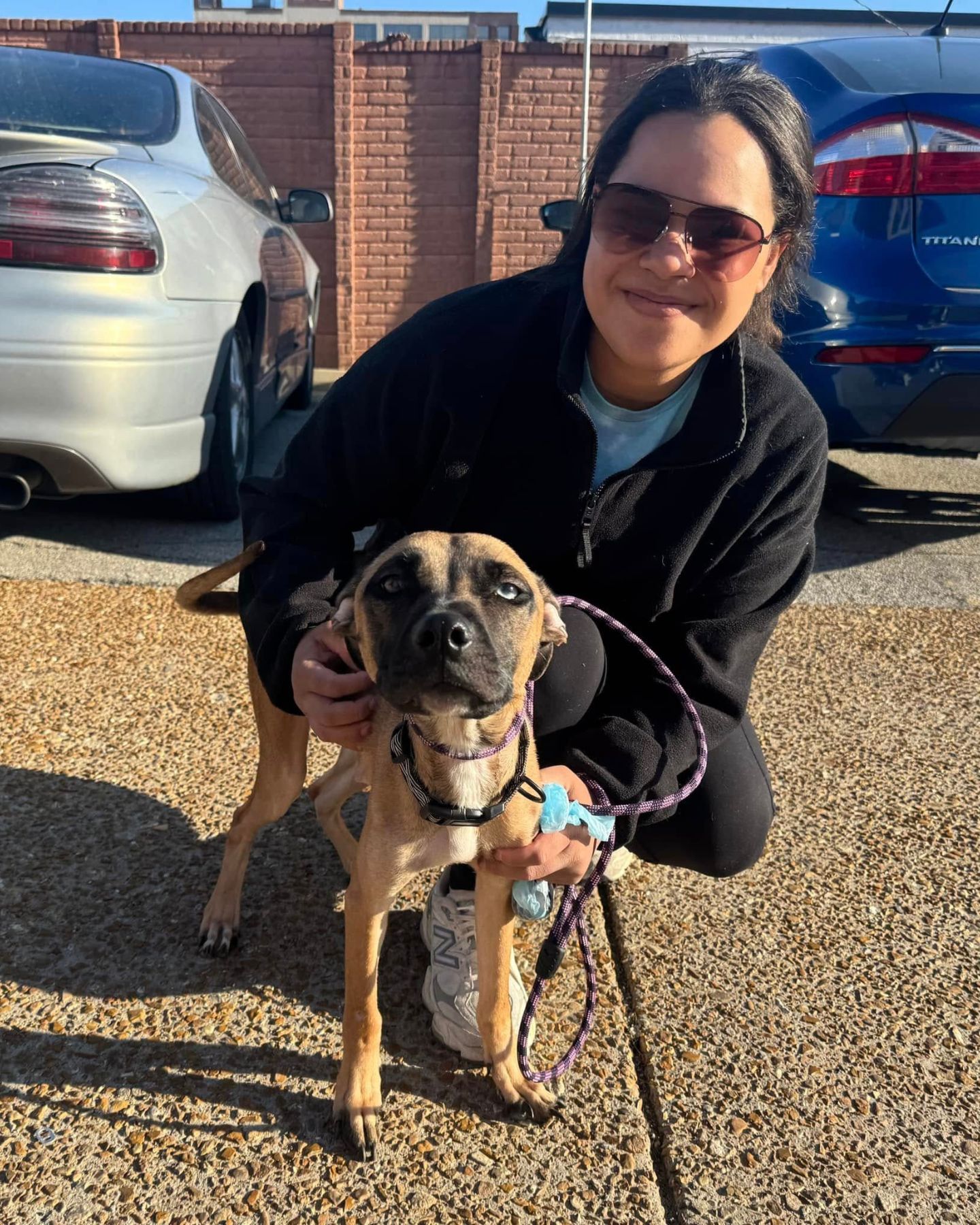 woman with a skinny dog