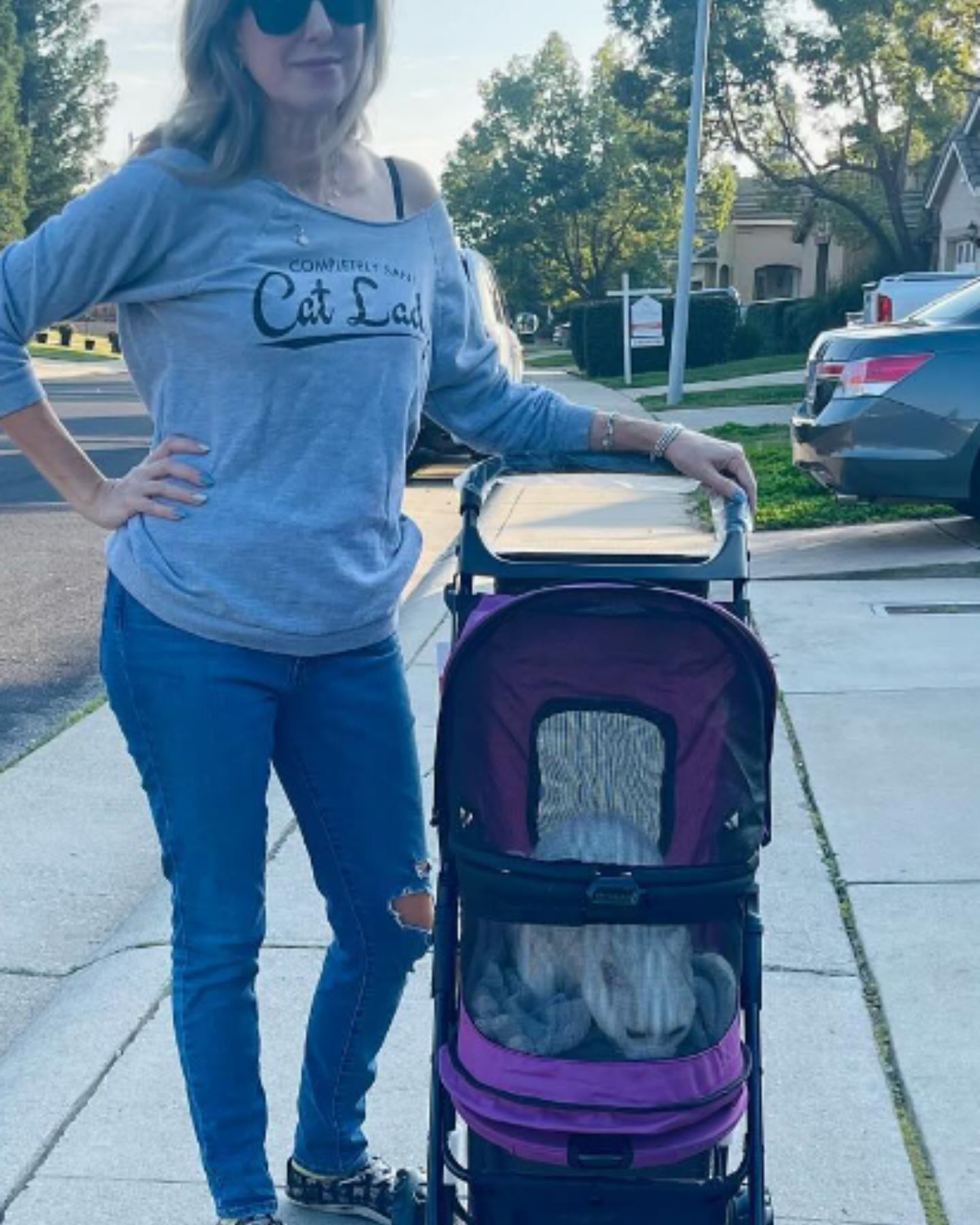 woman with cat in stroller