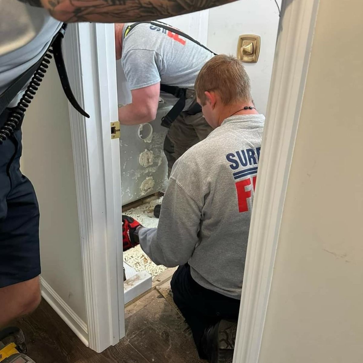 workers working in bathroom