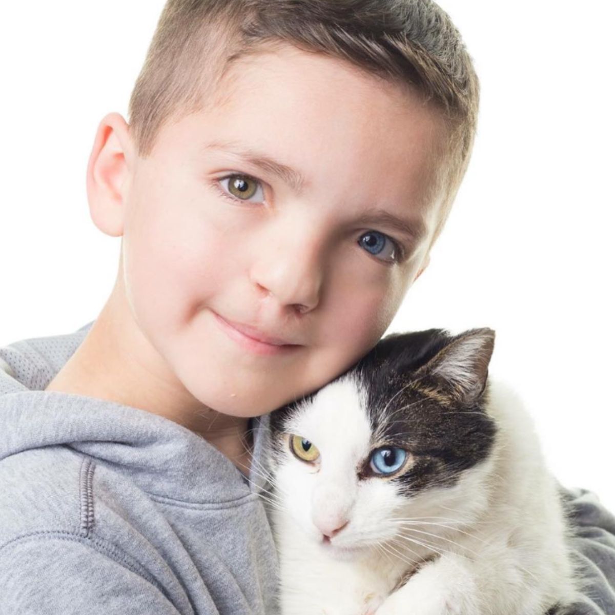 boy with a cat with different eye colors