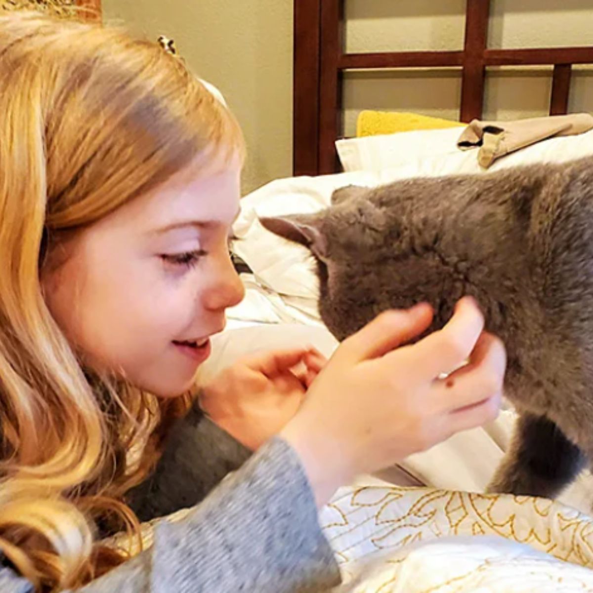 girl petting cat