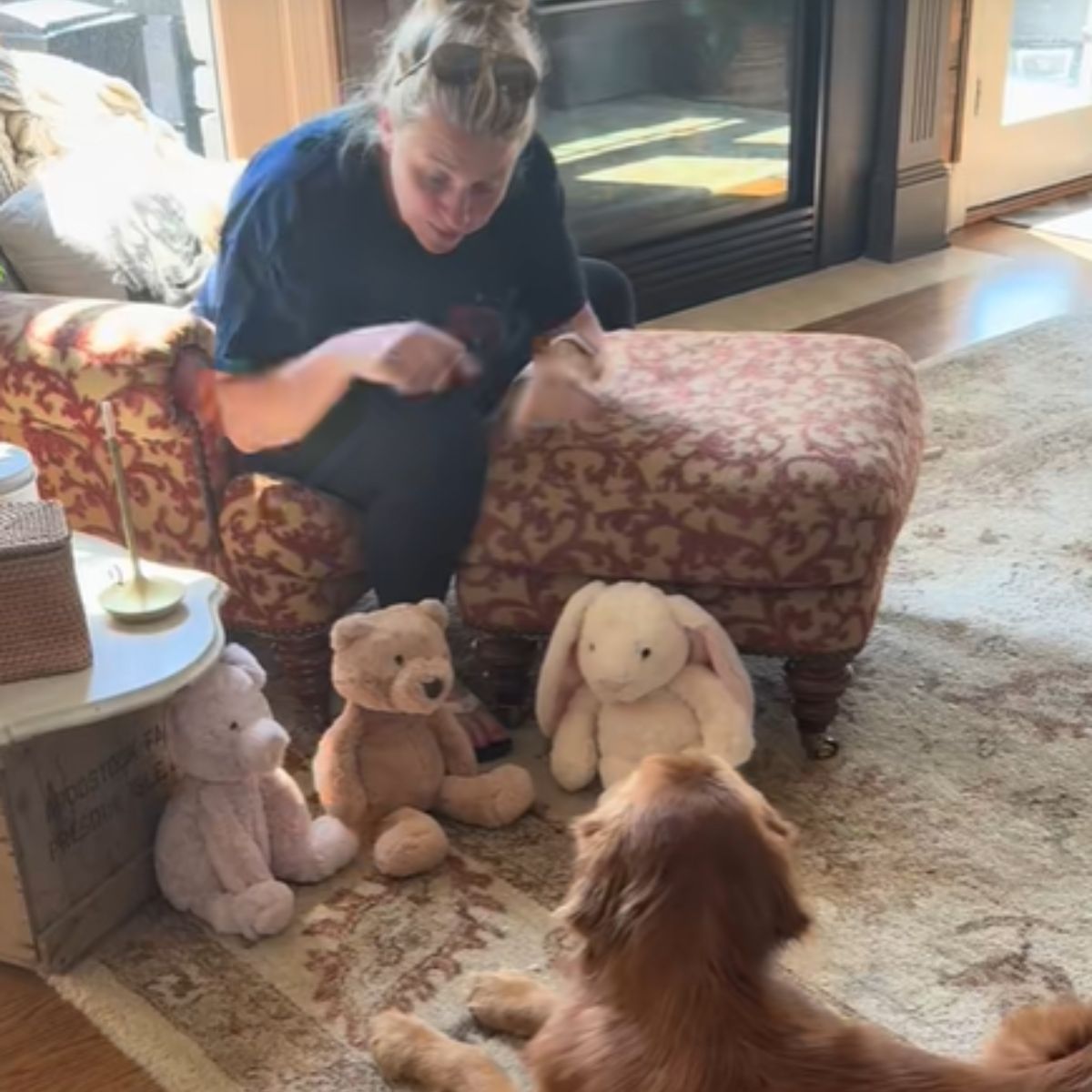golden retriever is playing with a woman