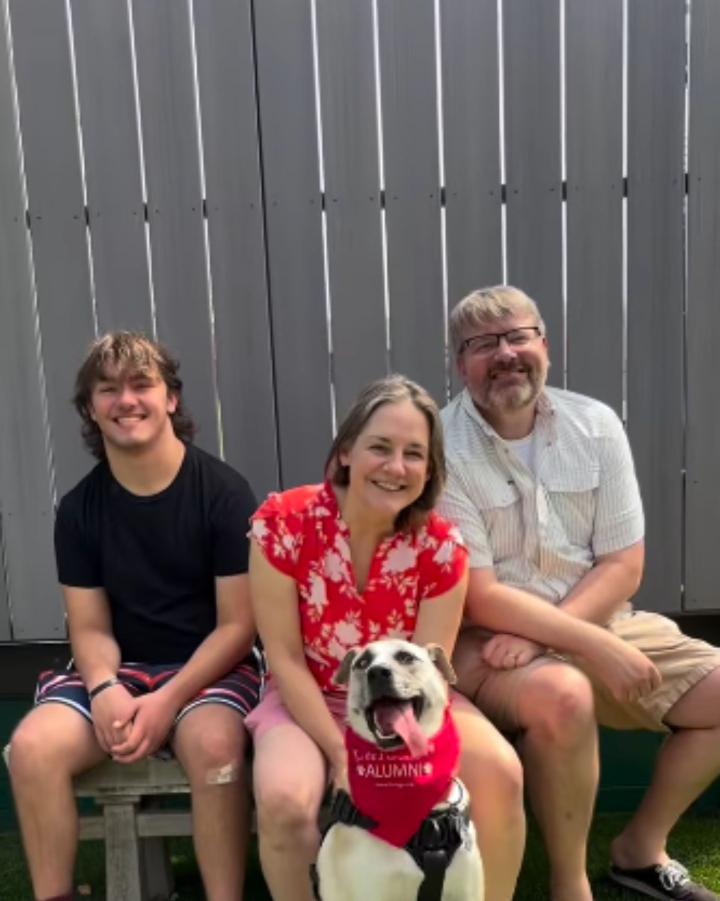 happy shelter dog with family