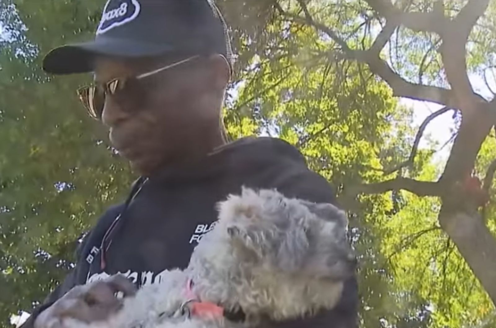 man carries a shaggy dog