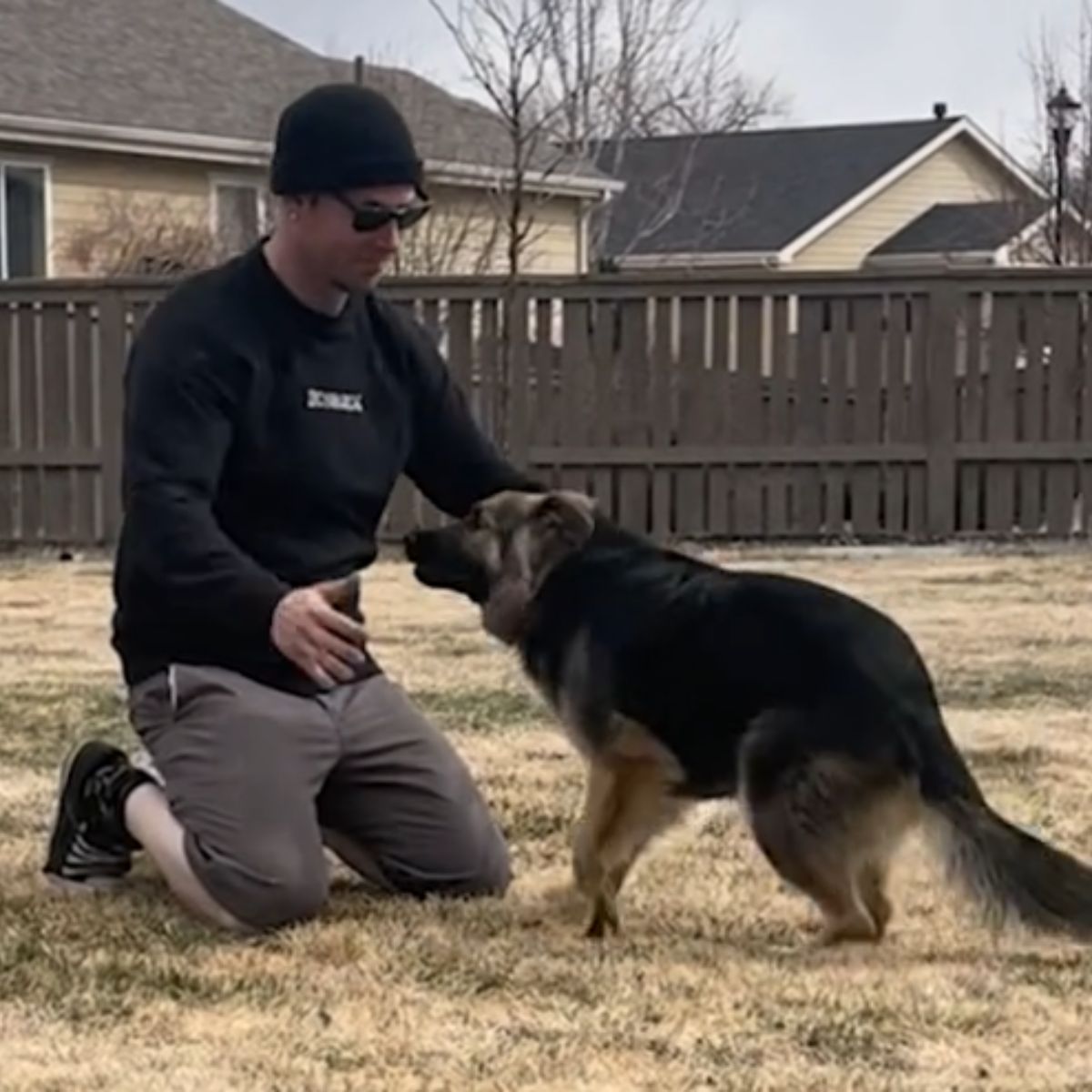 man plays with a dog