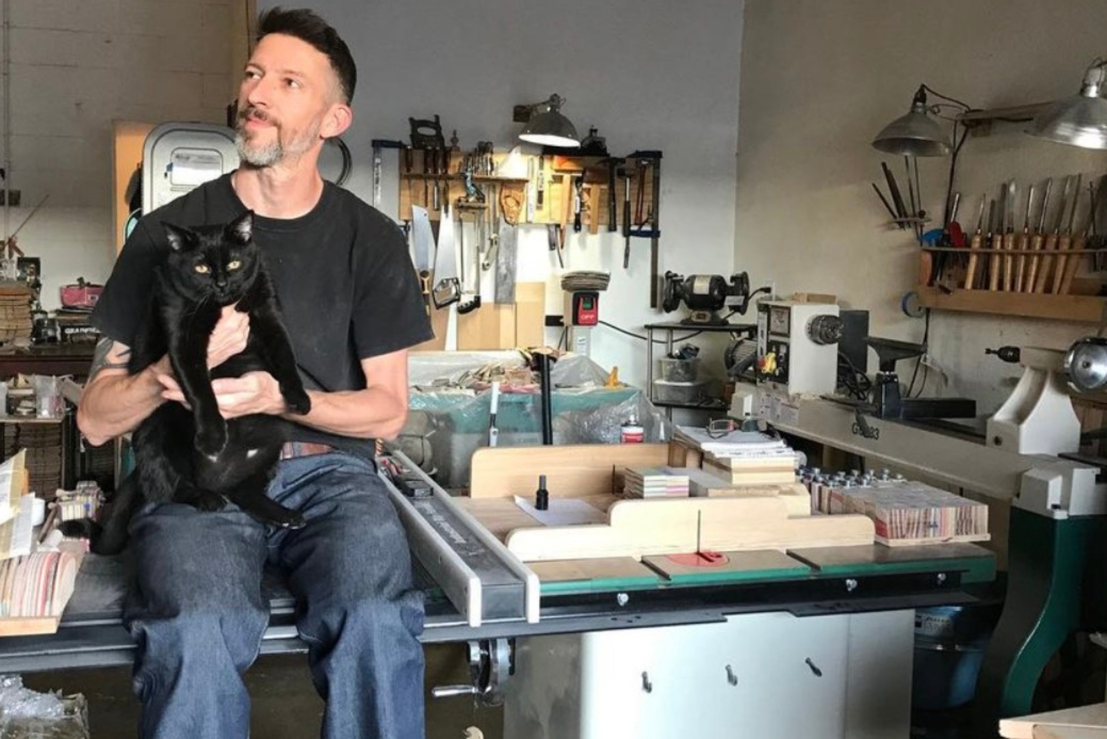 man with adopted black cat