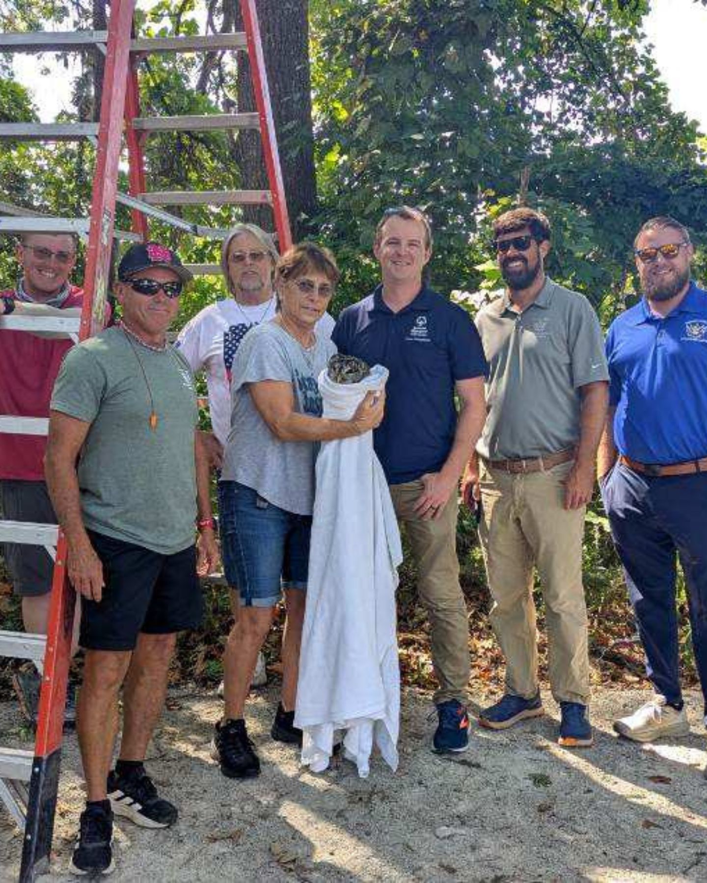 people with a rescued bird