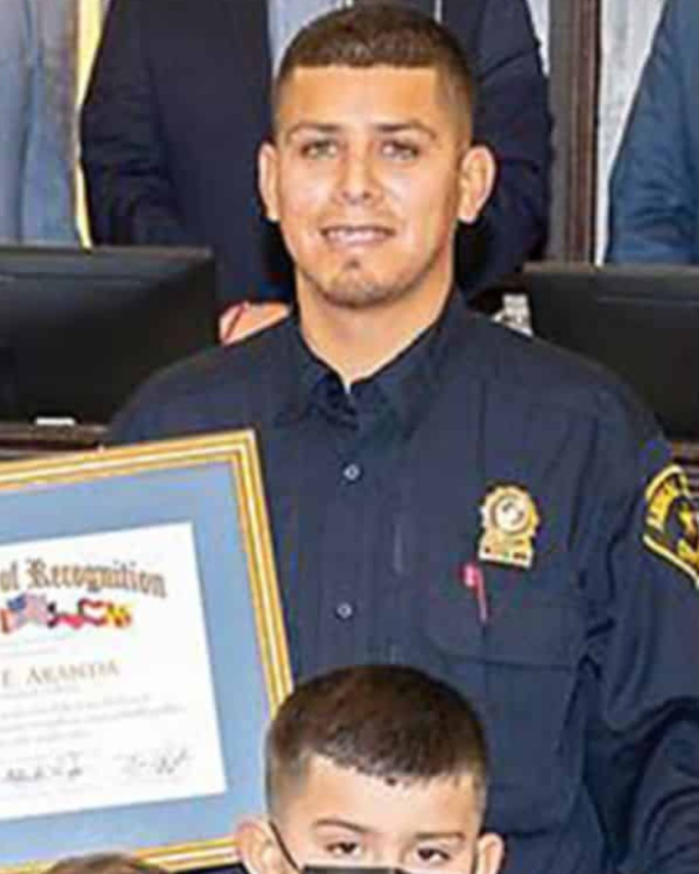 policeman with a thank you note in his hands