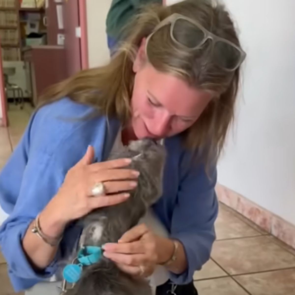 woman kisses a dog with diabetes