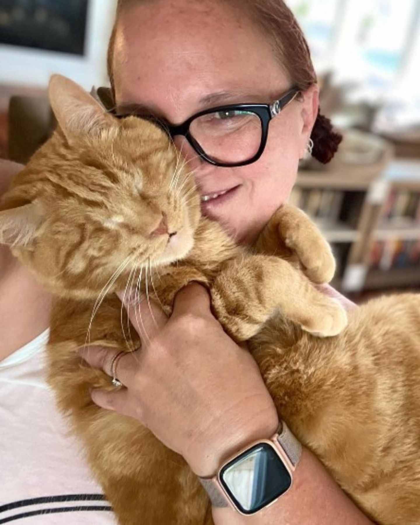 woman petting blind cat