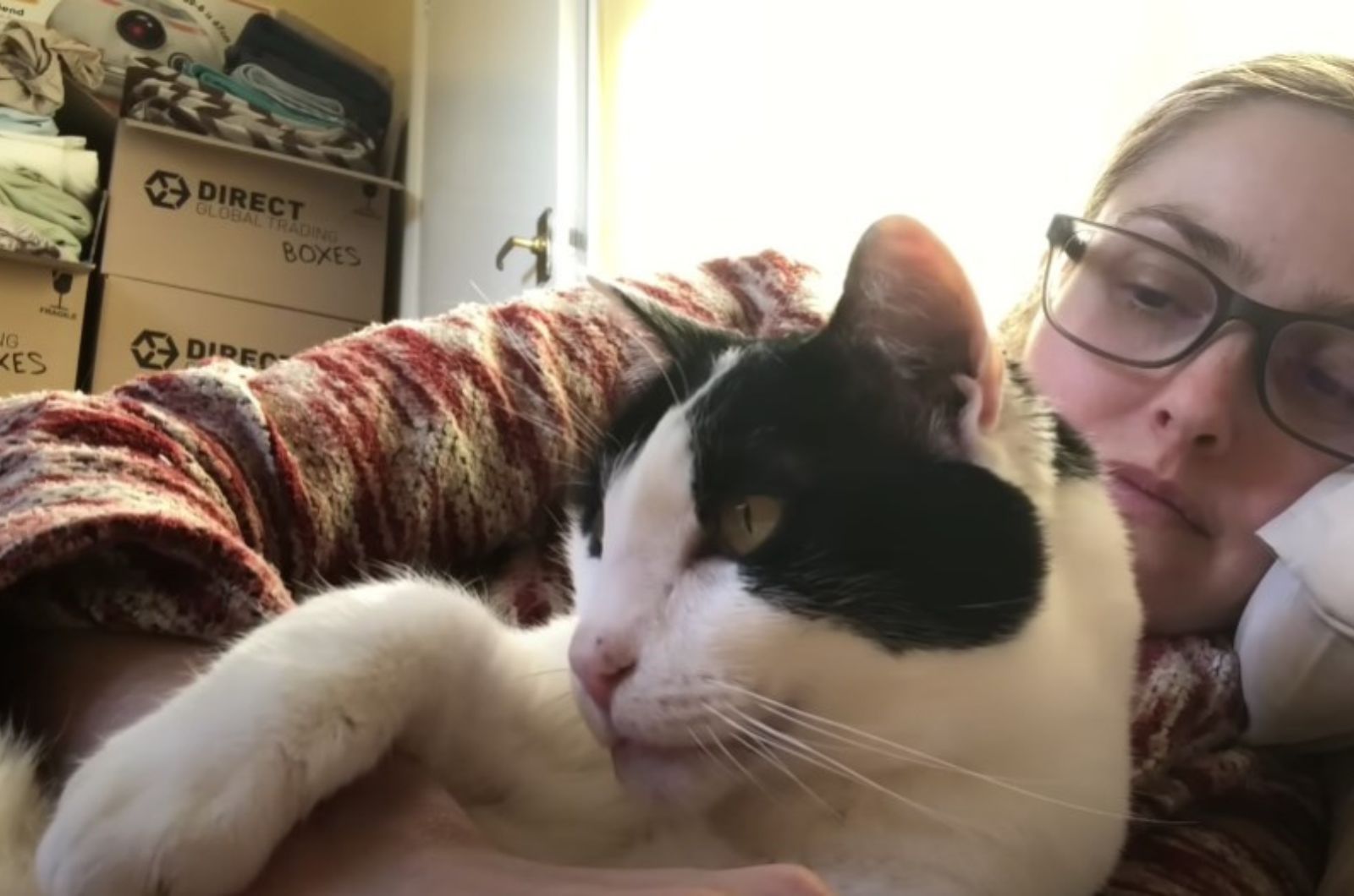 woman sleeping with cat