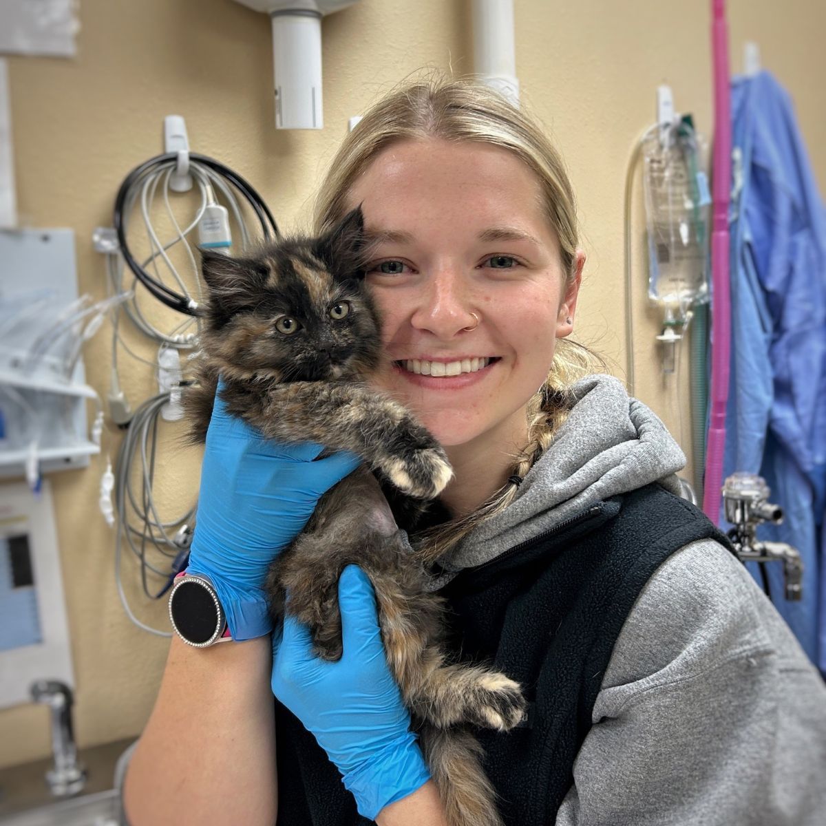 woman with kitten at vet