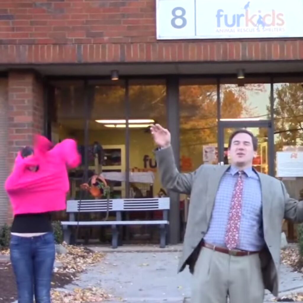 A man poses in front of a shelter