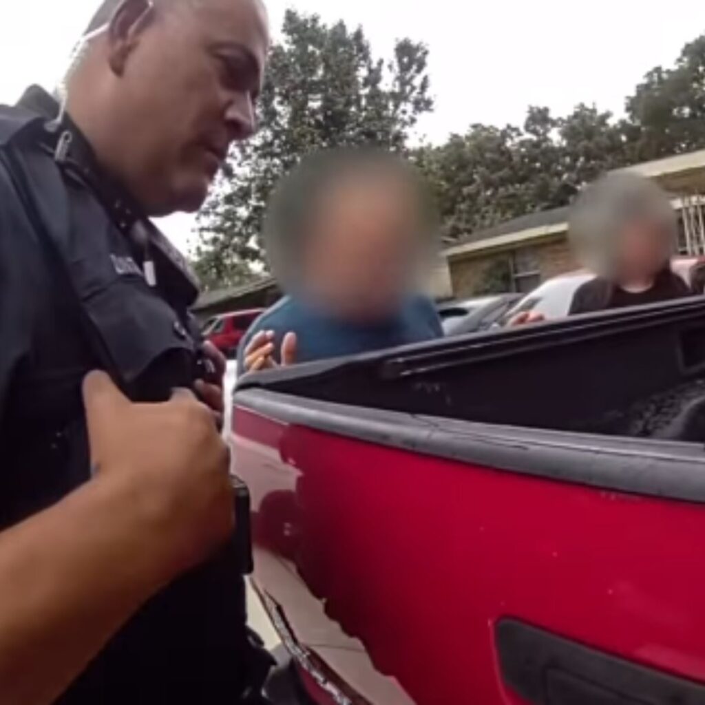 A police officer approached two boys in a car