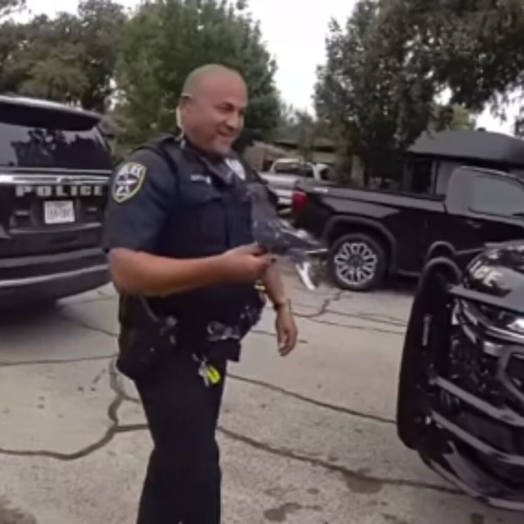 A policeman walks down the street