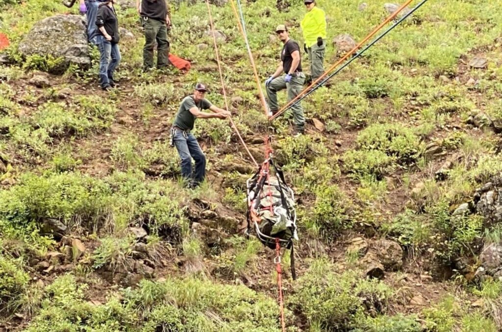 Rescuers are pulling a man out