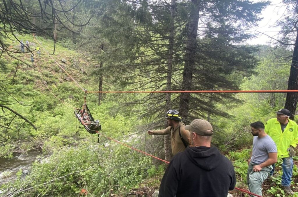 Rescuers with ropes save a man