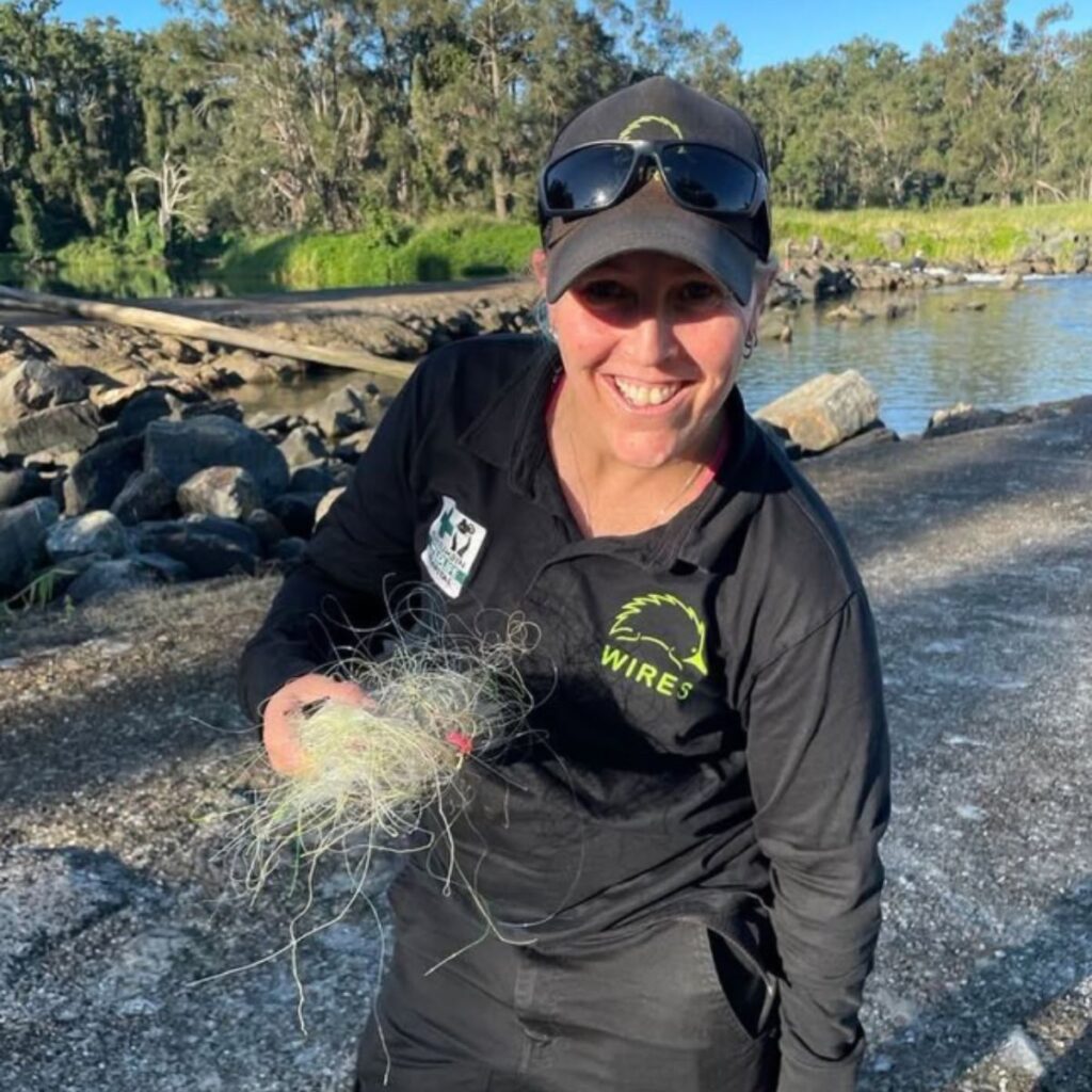 Smiling woman holding something in her hand