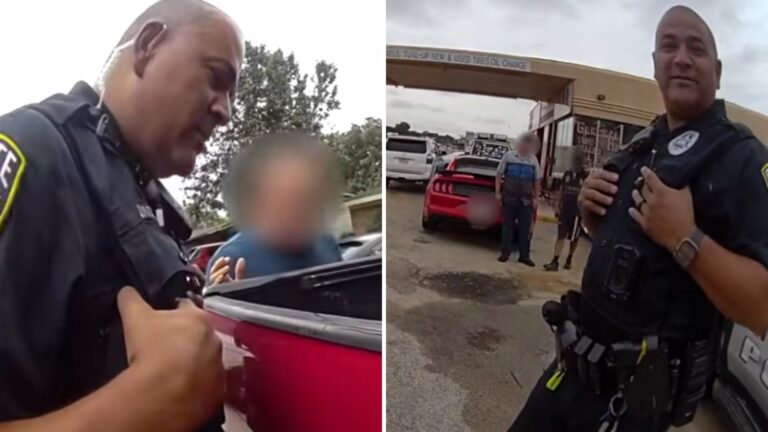 A policeman stands on the street