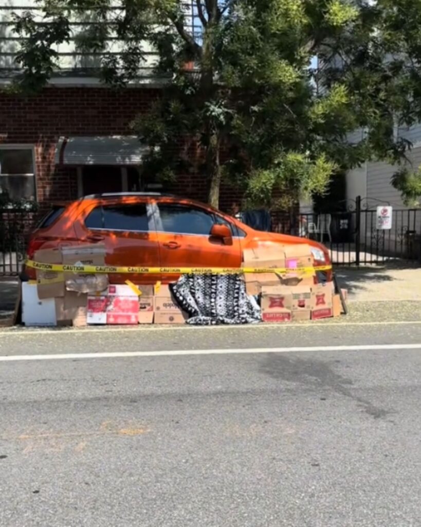a car covered with tape and cardboard