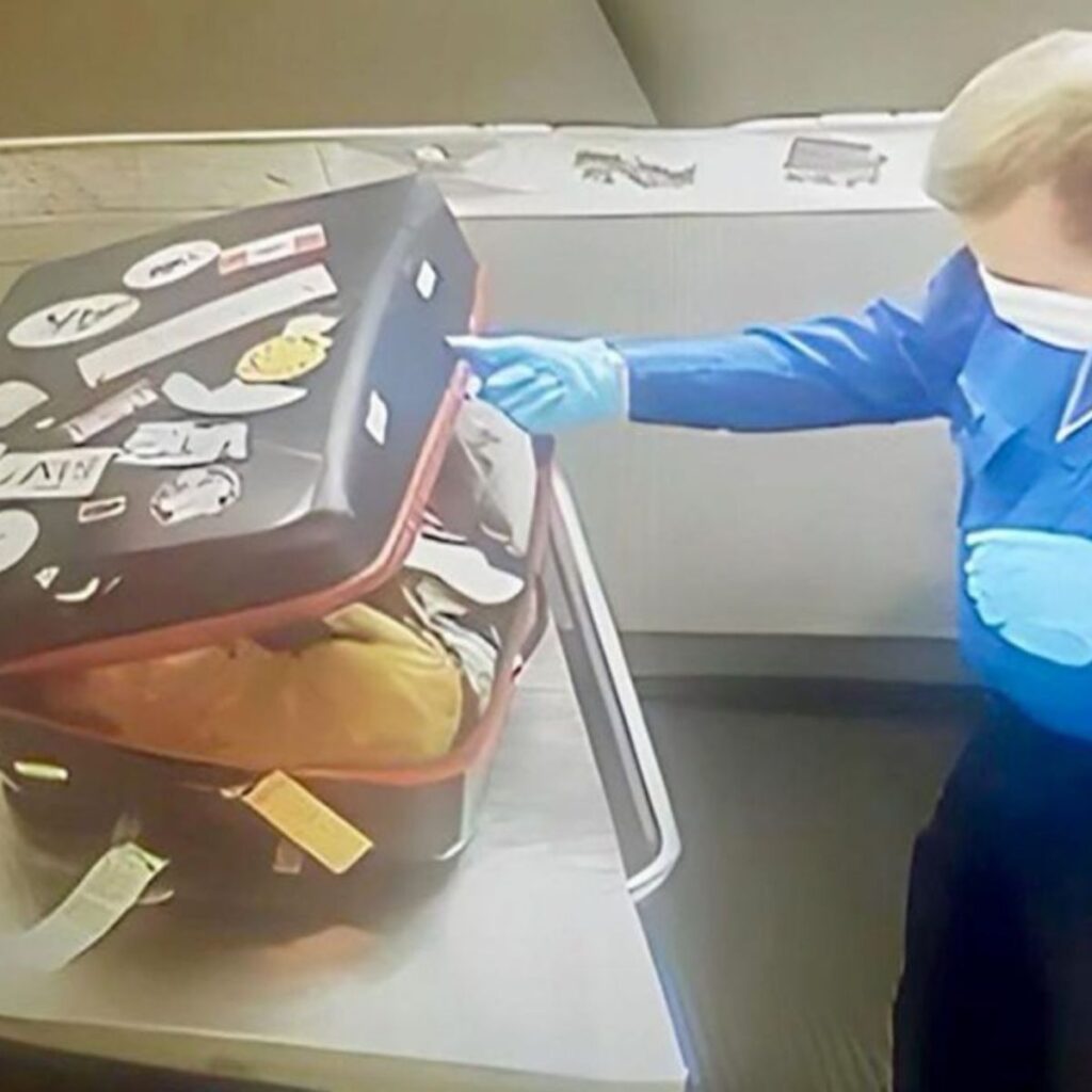 a man opens a suitcase