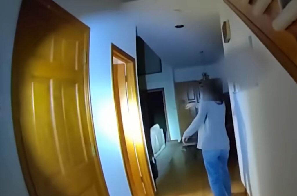 a woman walks around the house