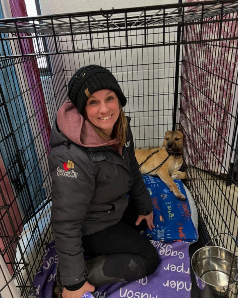 girl with dog sitting in cage