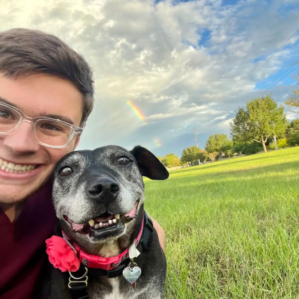 man and dog in the meadow