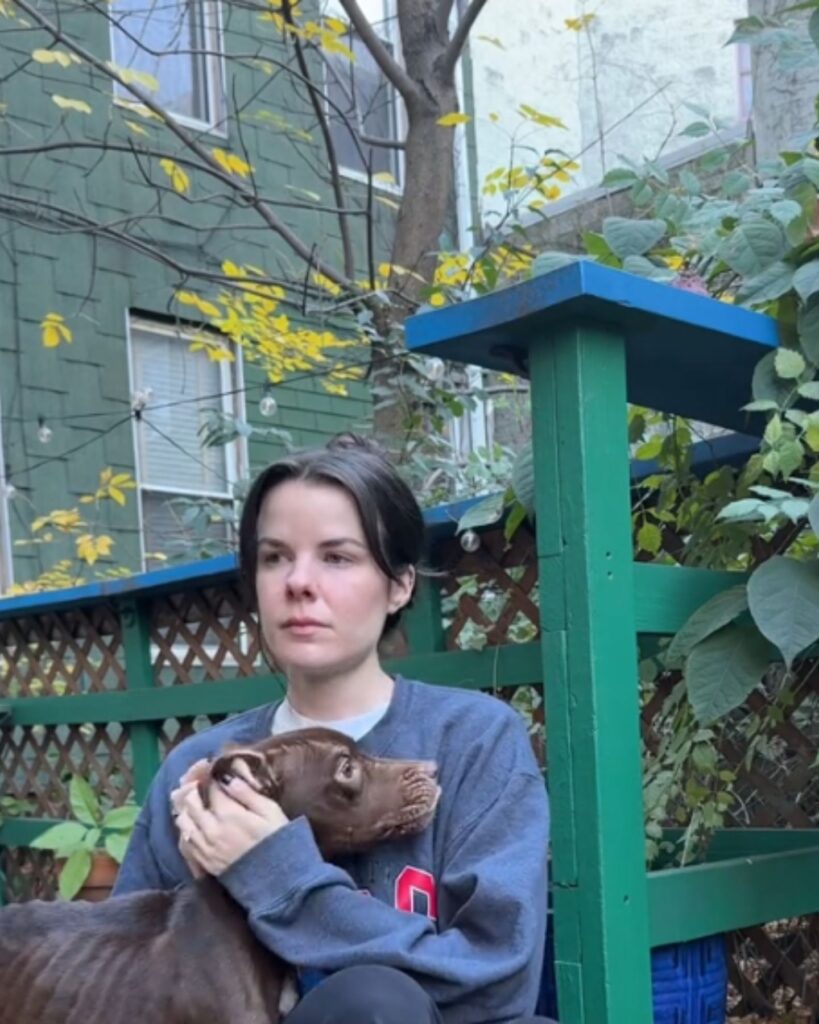 sad girl hugging a dog