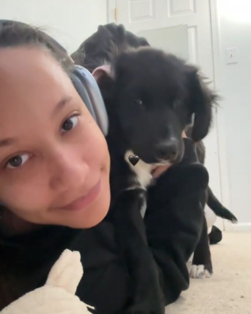 the dog climbed onto the girl's back