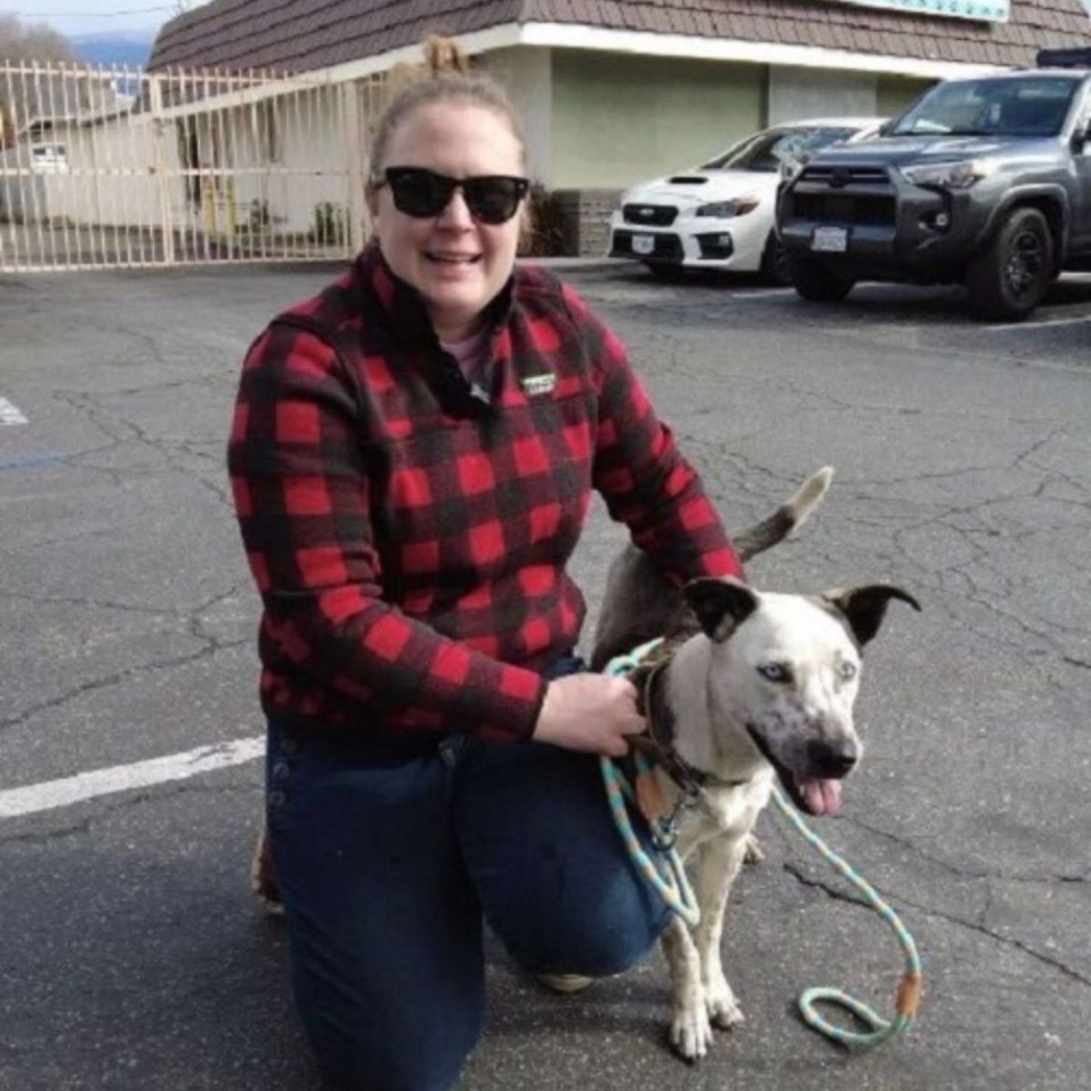 woman with a dog with blue eyes