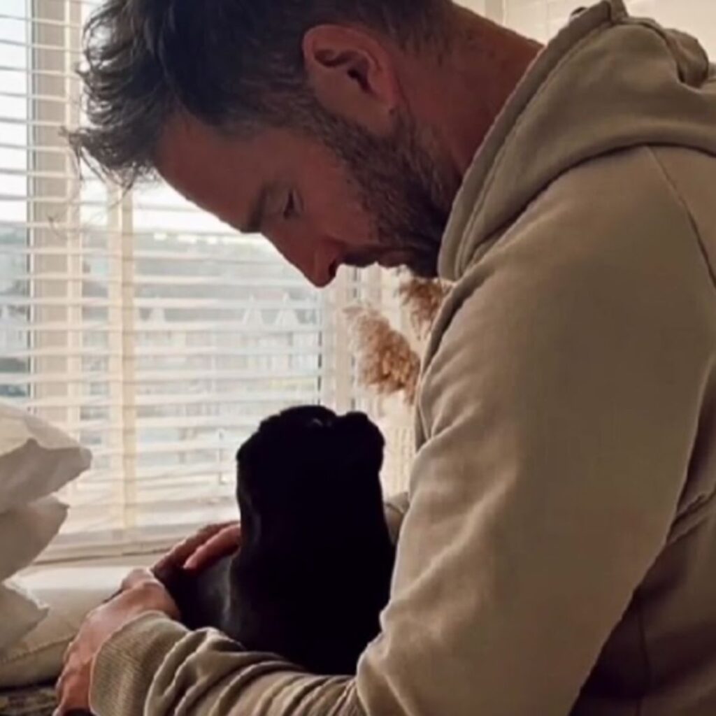 The dog and the man look at each other with a lot of love