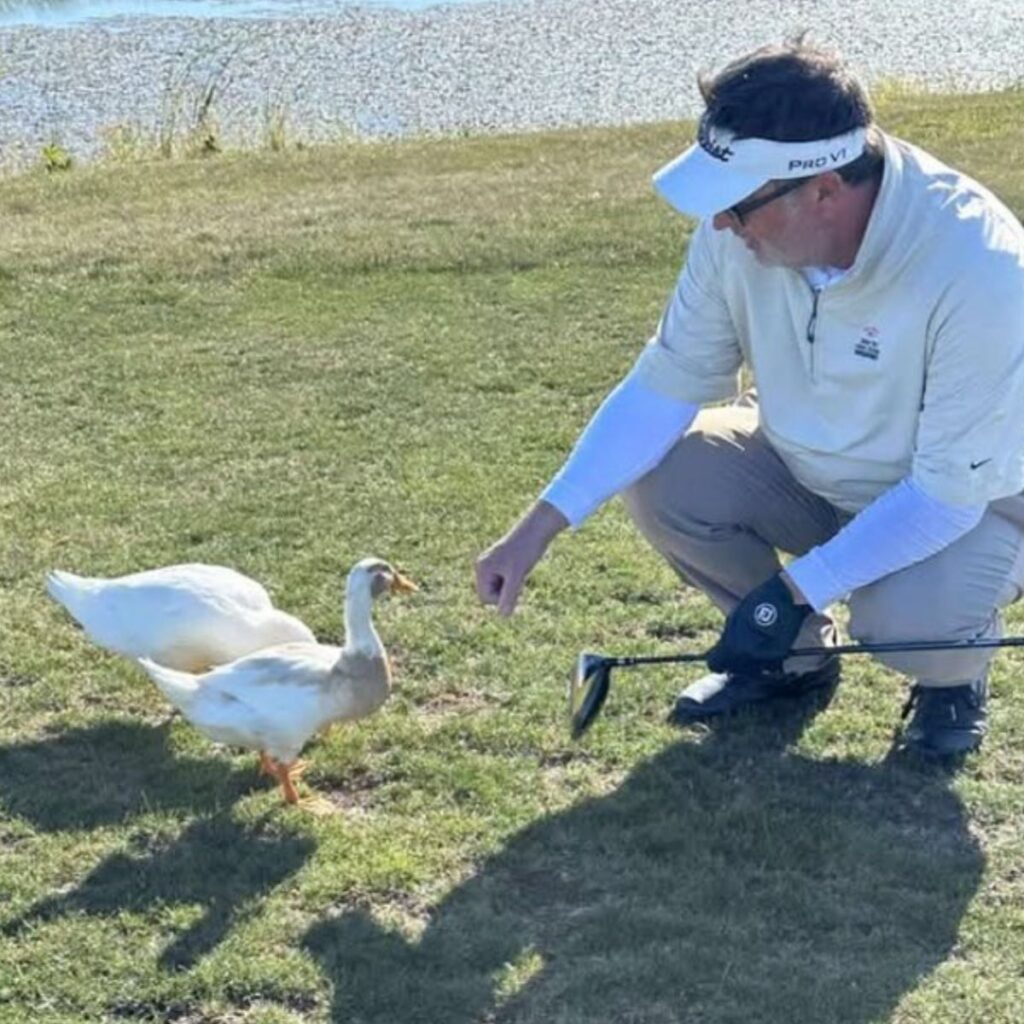 The man approached the duck