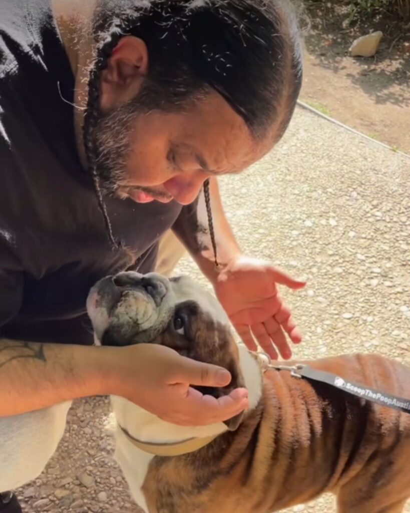 a man talks to a dog