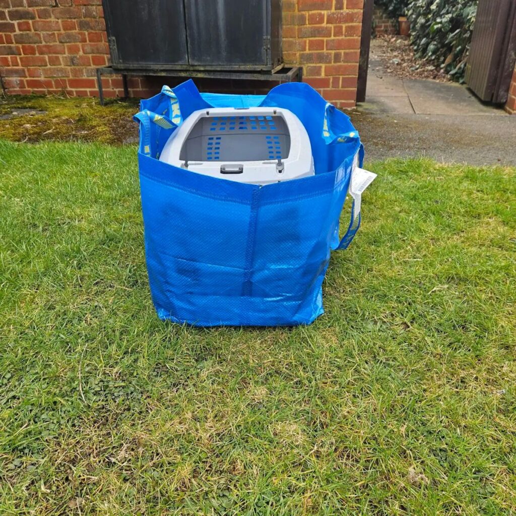 cage in a blue big bag