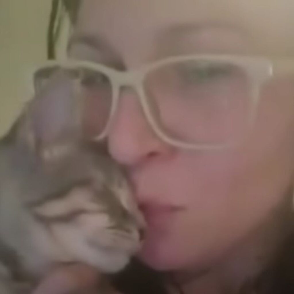 cat next to a woman's face