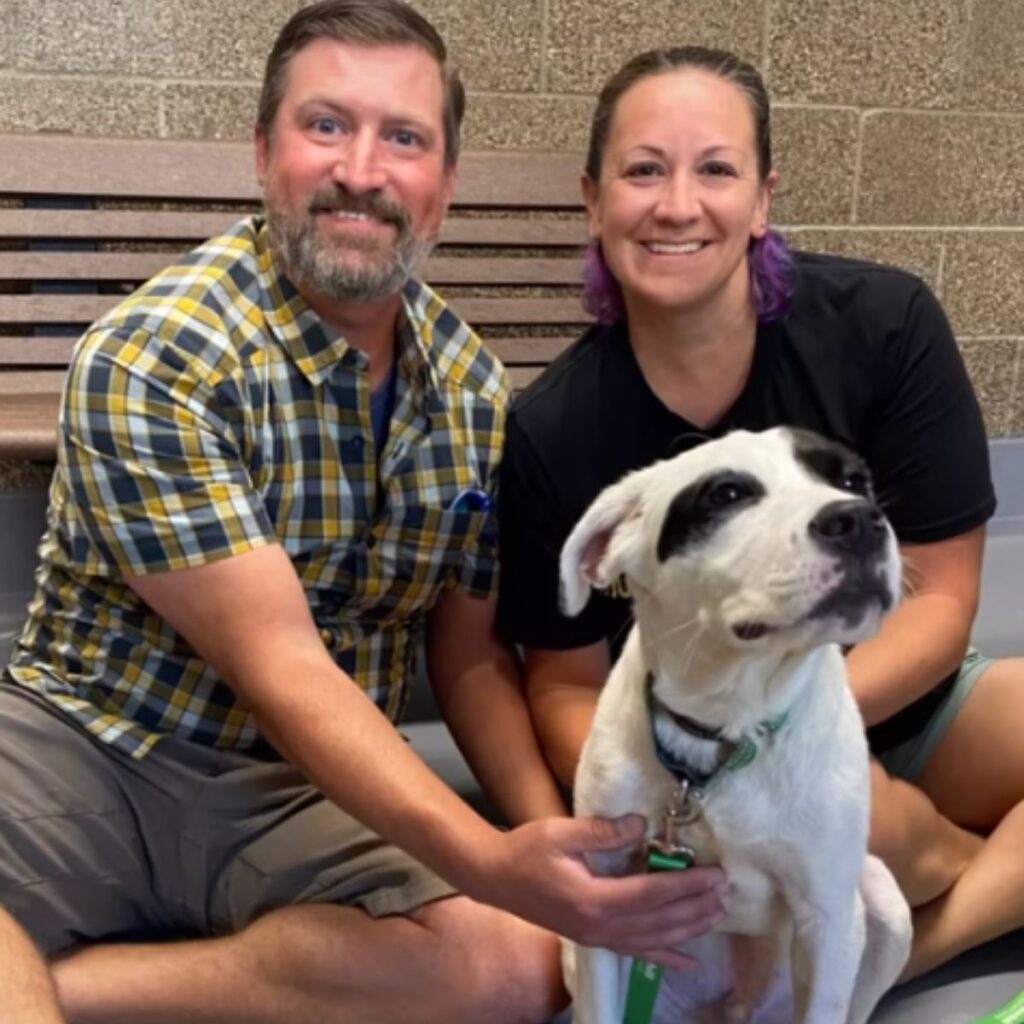 man and woman with a dog