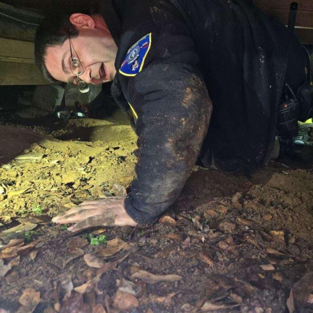 officer under a house