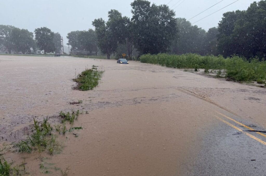 car stuck in floodwaters