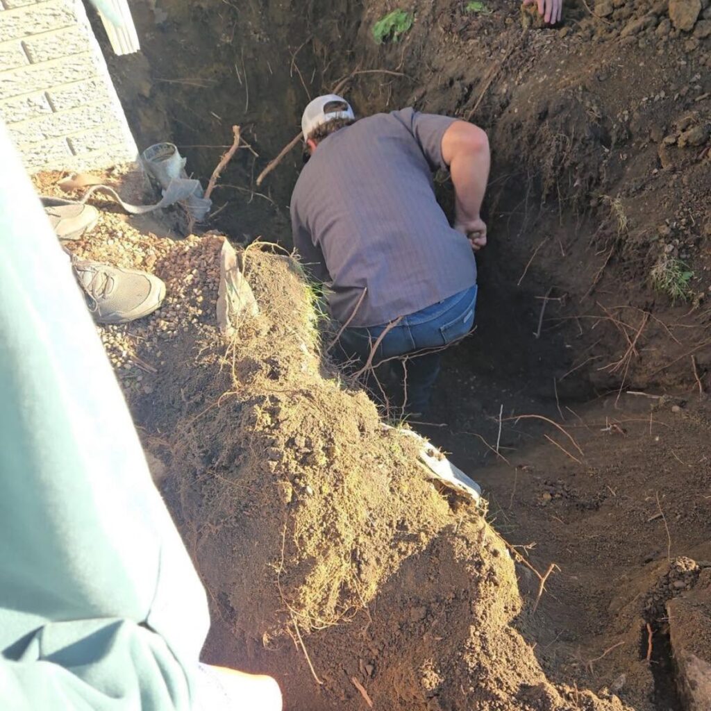 man digging a huge hole