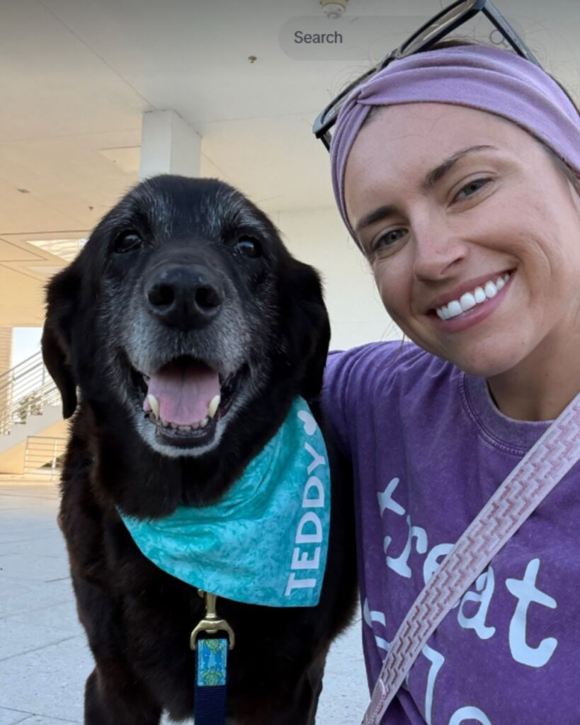 smiling woman and a dog