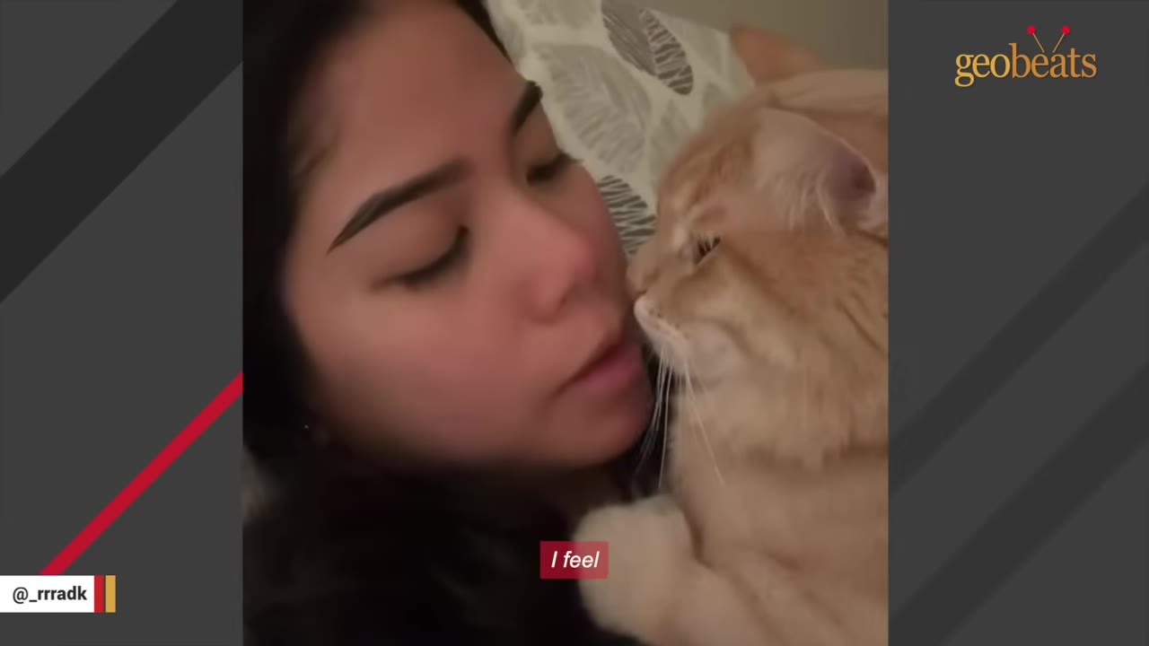 A close-up shot of a woman with her eyes closed snuggling with an orange cat resting near her face.