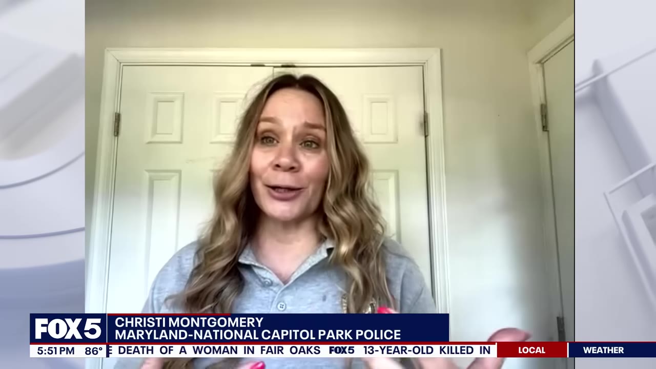 A video interview frame of Christi Montgomery from the Maryland-National Capitol Park Police, speaking in front of a white door.