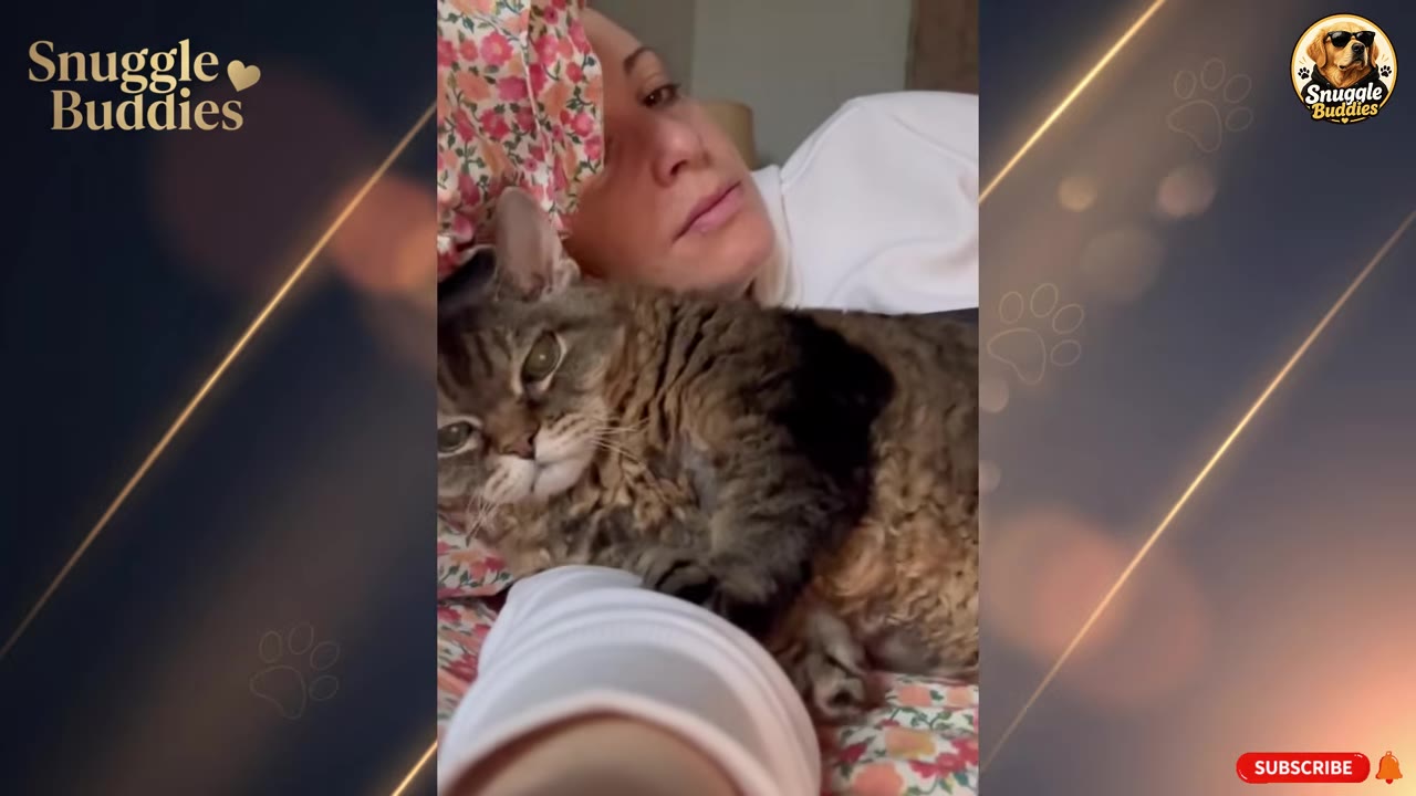 A tabby cat lies snuggled close to a woman's face on a floral pillow, looking relaxed and content.