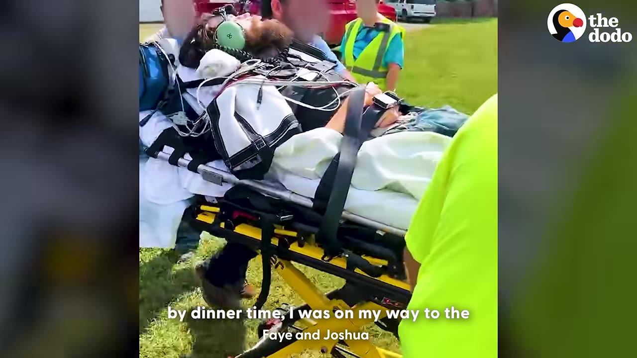 A man with a beard lies strapped to a yellow stretcher, wearing medical equipment and headphones, as emergency responders transport him outdoors.