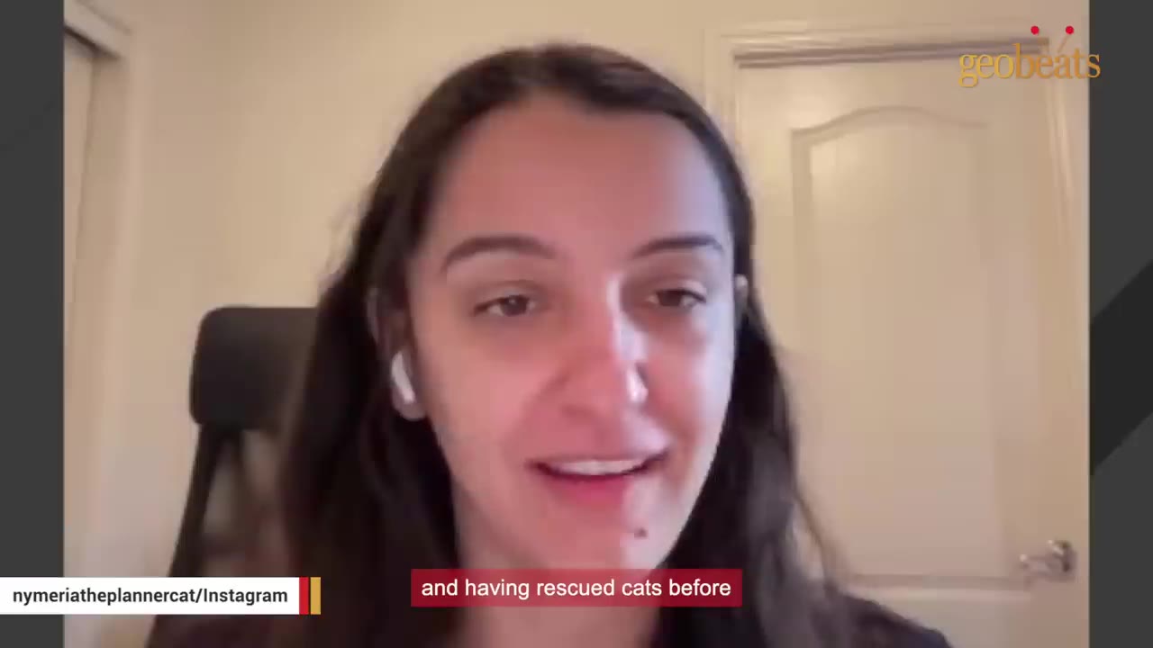A close-up shot of a woman with long dark hair speaking during a video call.