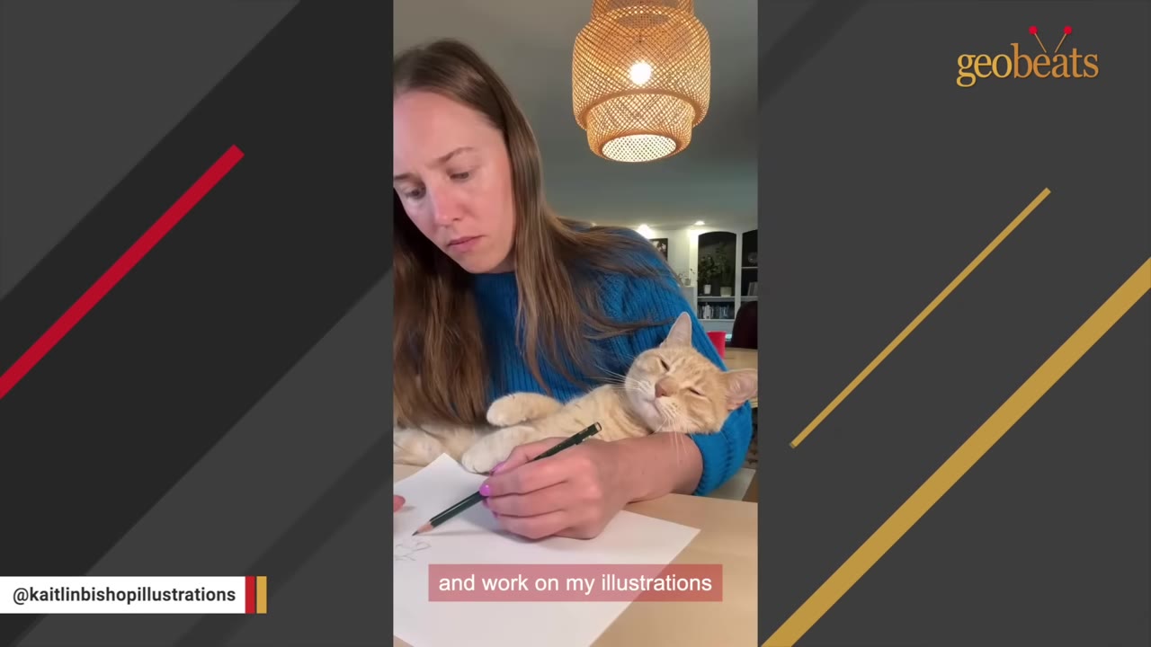 An orange cat rests comfortably in the arm of a woman as she draws on a piece of paper with a pencil.